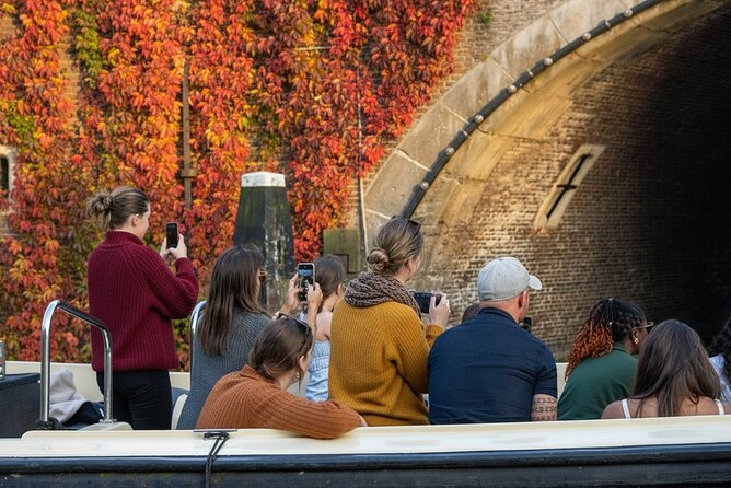 Amsterdam 1-Hour Canal Cruise With Live Guide - Stop-by-stop: what the guide points out along the way