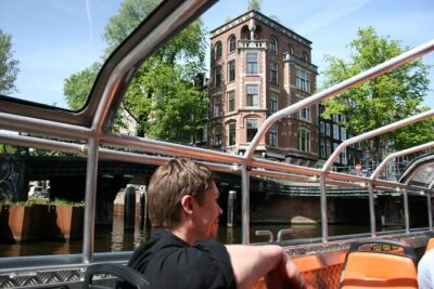 Amsterdam 1h Canal Cruise by Semi-Open Boat with Audio Guide - Where to Meet: Lovers Canal Cruises at Prins Hendrikkade