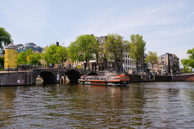 Amsterdam 1h Canal Cruise by Semi-Open Boat with Audio Guide - From the Red Light District to Unmistakable Canal Homes
