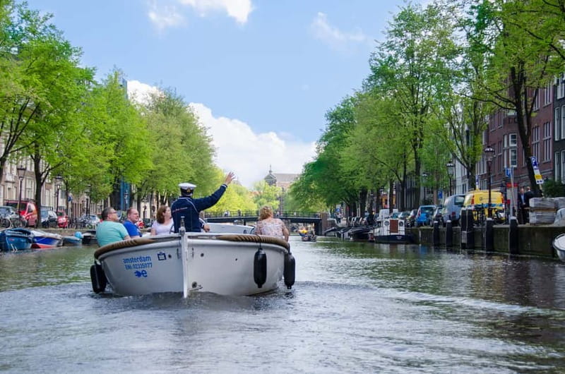Amsterdam: 75 minute Open Boat Canal Cruise with Live Guide - The route hits the classics: Westerkerk, Prinsengracht, and Amsterdam Centraal
