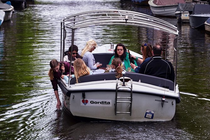 Amsterdam 90-min Private Canal Cruise with Live Guide and Drinks - Amstel River, Dancing Houses, and Monet-Era Light