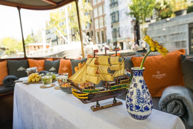 Amsterdam Canal Cruise with Cheese and Wine - Landmark tour along the way: Anne Frank context, Magere Brug, Munttoren, and the Flower Market
