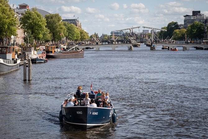 Amsterdam Canal Cruise with Live guide & Two drinks - Central St. - Old Church and Historic Streets: The City’s Vertical Story