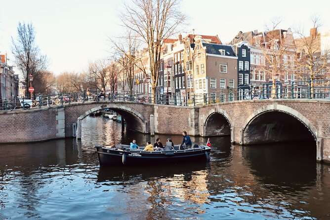 Amsterdam Canal Tour by Open Boat – 90 min Small Group Experience - Kolksluis Lock And Old Warehouses: Medieval Engineering, Still In Use