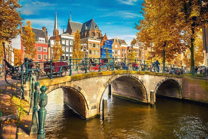 Amsterdam Classic Saloon Boat Cruise with Drinks and Cheese - A 1-Hour Canal Reset on a Fully Covered Wooden Saloon Boat