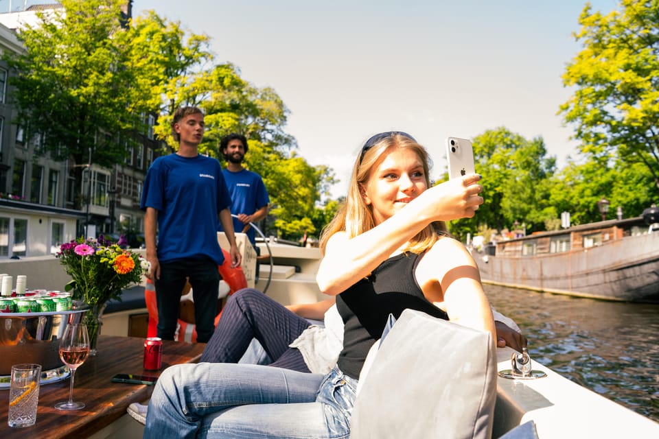 Amsterdam: German Guided Canal Cruise with on Board Bar - The oldest landmarks: Oude Kerk and Basilica of Saint Nicholas
