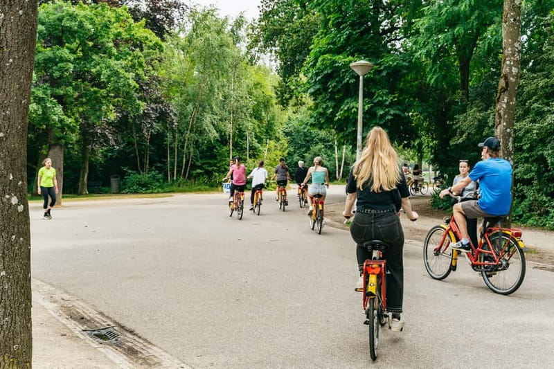 Amsterdam: Guided Bike Tour City Centre in EN/DE/FR/ES - Jordaan + 9 Straatjes: canalside charm with practical shopping street energy