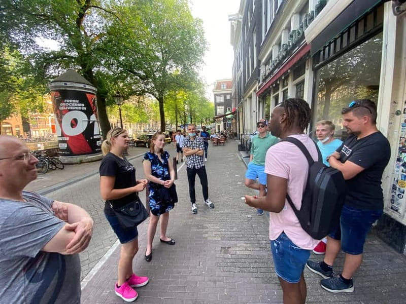 Amsterdam: Guided Ganja Walking Tour of Coffee Shops - Royal Palace start: getting your bearings fast
