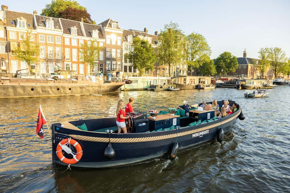 Amsterdam: Guided Open Boat Canal Cruise Including Drink - Finding the Dock by Amsterdam Centraal (and the Red Banner)