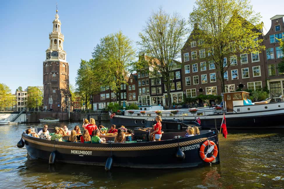 Amsterdam: Guided Open Boat Canal Cruise Including Drink - The Live Commentary: How the Guide Keeps It Moving
