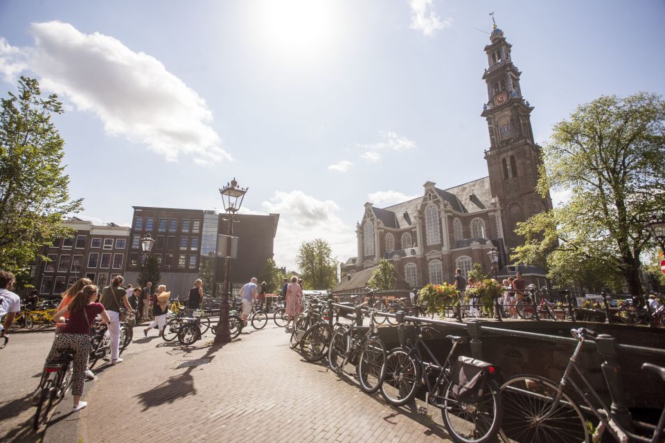 Amsterdam: Hidden Gems & Highlights Guided Bike Tour - Meeting at the provider office: bikes, group size, and what you’ll feel on Day One