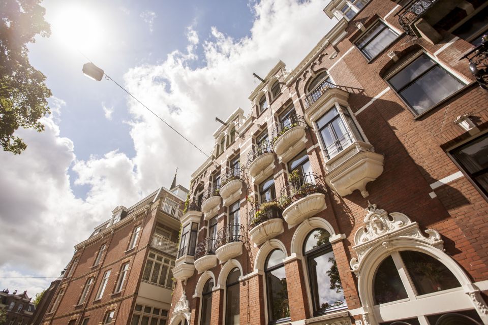 Amsterdam: Hidden Gems & Highlights Guided Bike Tour - Museumplein finish: get oriented fast for Rijksmuseum, Van Gogh, and Concertgebouw