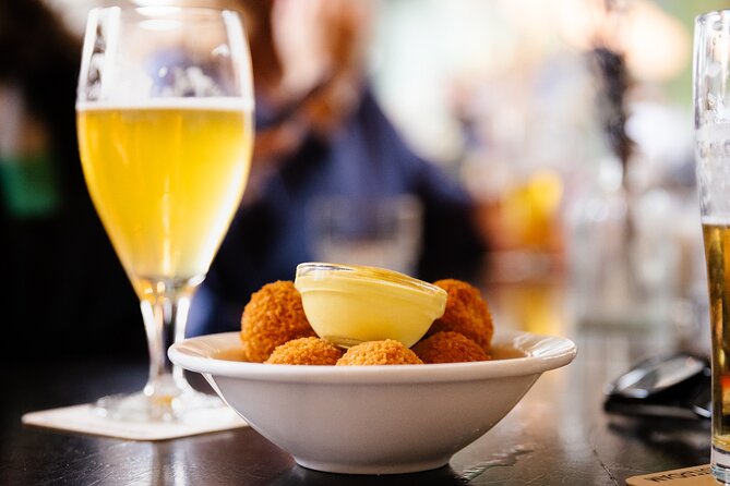 Amsterdam High-End Dutch Food & History Tour - Up to 8 guests - Sundays and Mondays: grillworst crunch, a famous croquette, and Indonesian spekkoek