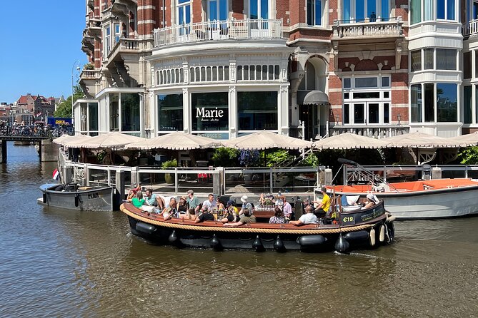 Amsterdam Luxury Boutique Boat tour with Unlimited Beer and Wine - Magere Brug (Skinny Bridge) and the photo moment you shouldn’t miss