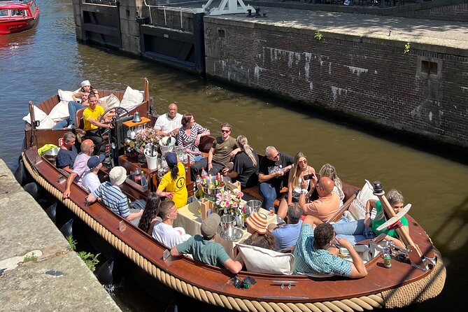 Amsterdam Luxury Boutique Boat tour with Unlimited Beer and Wine - Guide style: small-group fun, but pacing can vary