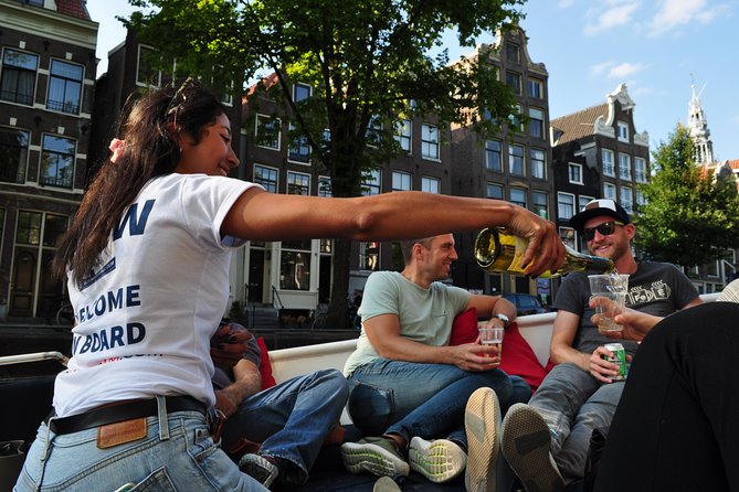 Amsterdam Open Boat Cruise with Live Guide and Two Drinks - Winter and cold-weather reality: open air vs covered boat