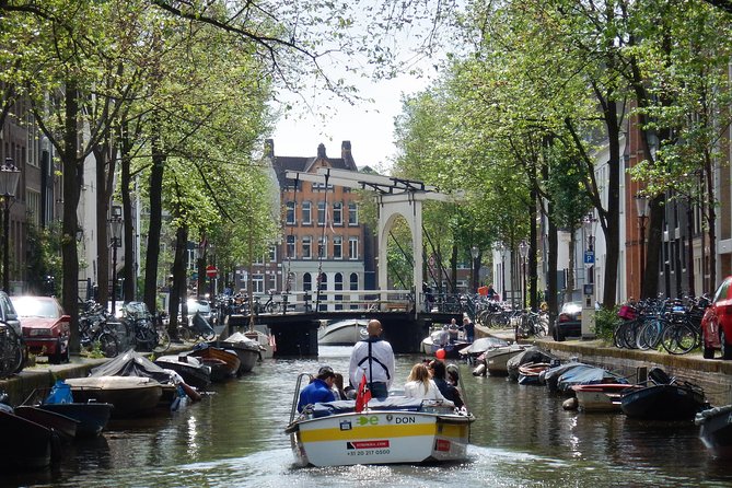 Amsterdam Open Boat Tour with Local Guide - Comfort and the weather reality of open boats