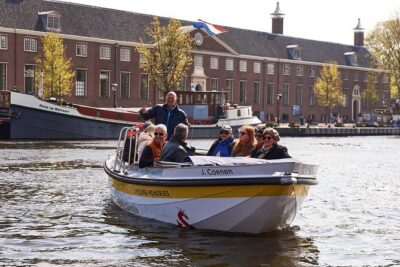 Amsterdam Open Boat Tour with Local Guide - Your one-hour route: classic canals plus two unforgettable bridge moments