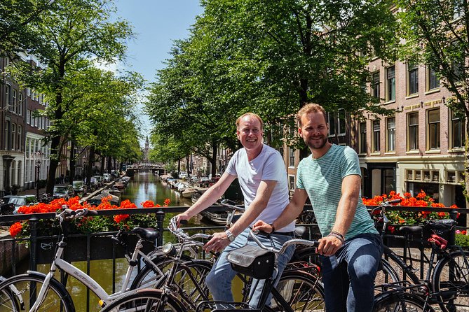 Amsterdam PRIVATE Bike Tour With Locals: Bike & Local Snack Included - Magere Brug (Skinny Bridge): the photo-and-structure moment