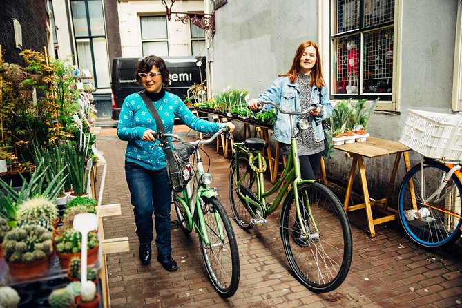 Amsterdam PRIVATE Bike Tour With Locals: Bike & Local Snack Included - Homomonument: a respectful pause with local storytelling