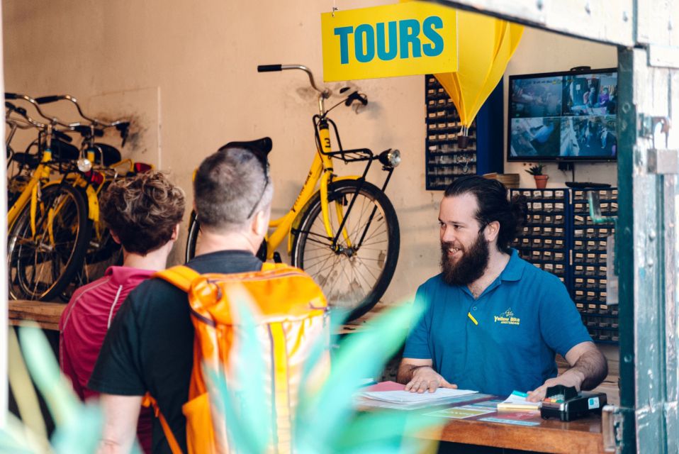 Amsterdam: Relaxed City Highlights Guided Bike Tour - Starting at Nieuwezijds Kolk: Mokum right out of the gate