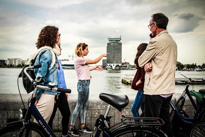 Amsterdam Small-Group Bike Tour With Canal Cruise, Drinks, Cheese - The narrowest bridge: a bike crossing that feels like a postcard