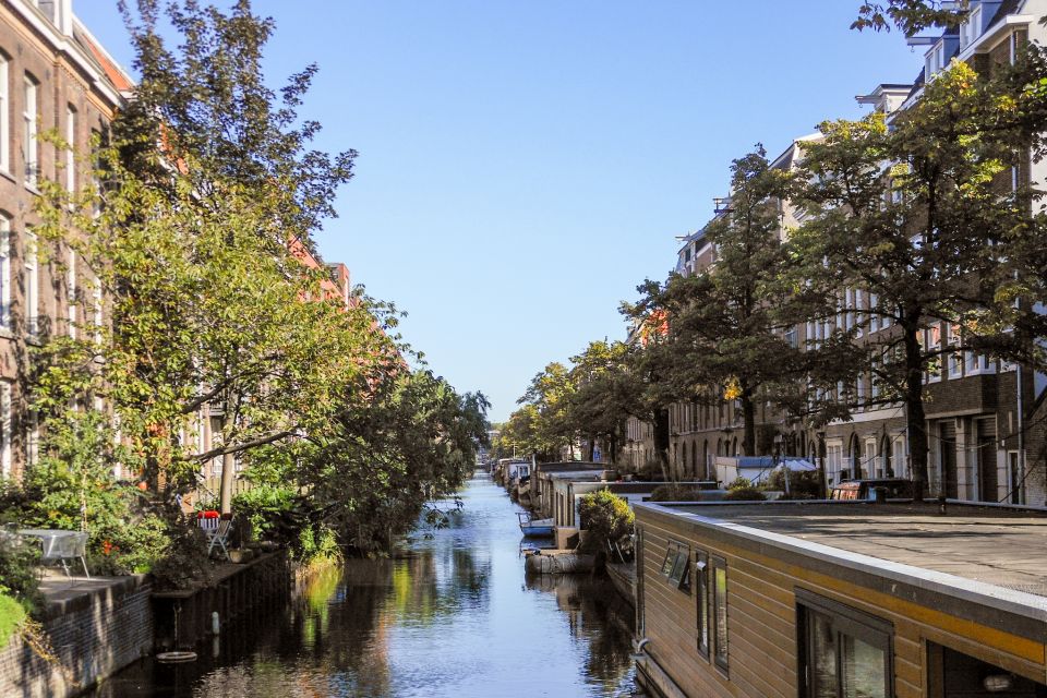 Amsterdam Walking Tour and Canal Cruise - The canal cruise: water-level Amsterdam in 60 minutes