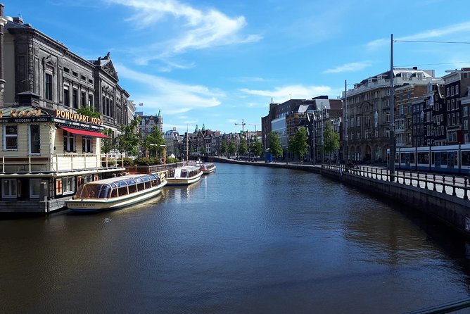 Private Tour: Amsterdam City Walking Tour and Canal Cruise - Comfort and logistics: weather, shoes, and cyclists to watch
