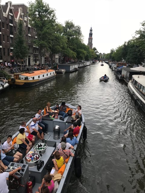 Visit Amsterdam by Boat with a French Guide (french) - A small-boat canal cruise with French stories (and a proper aperitif)